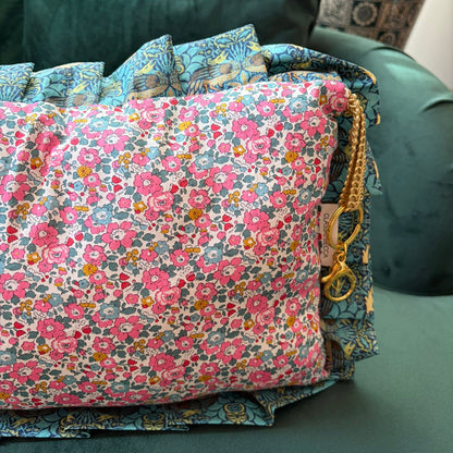 Floral fabric with colorful patterns on a green couch